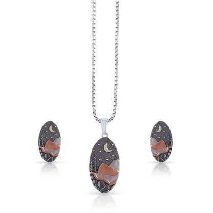 Brown pendant and earring set with moon and mountains design 